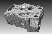 Die Darstellung zeigt das Hybrid-CAD-Modell eines Zylinderkopfs. Die Gussflächen werden als Freiformflächen und die bearbeiteten Flächen als Konstruktionsflächen dargestellt.